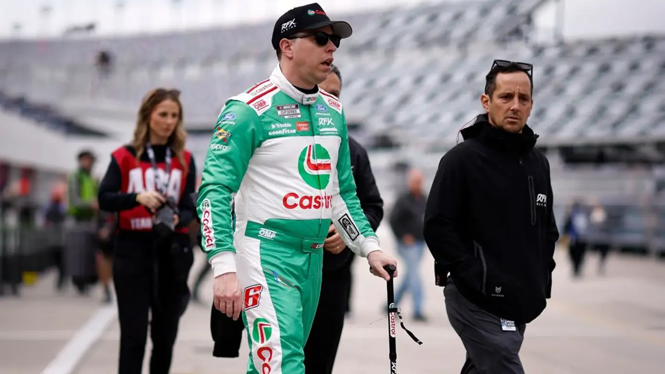 Brad Keselowski walking with a cane after break his femur 8 weeks before the Daytona 500.